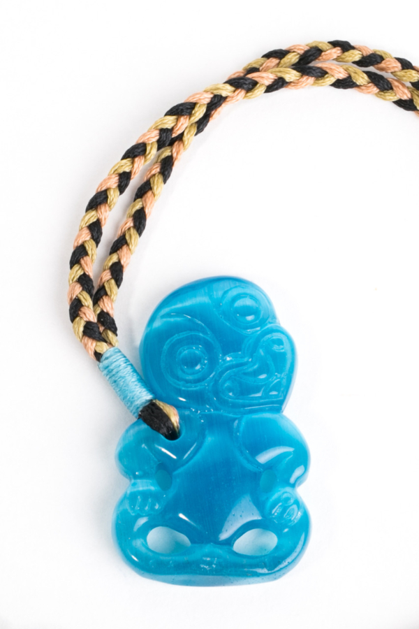 Hei Tiki, Blue beryl on brown/black cord